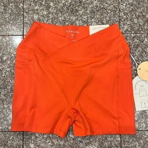 POPFLEX Crisscross Scrunch Bike Shorts in Spicy Orange NWT